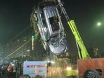 NDRF teams retrieve the car of deceased Yuvraj Mehta from a water-filled pit at the construction site in Sector 150 of Greater Noida, after the accident on the intervening night of January 16-17, in Greater Noida
