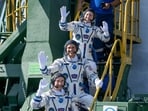 Expedition 75 Roscosmos cosmonaut Anna Kikina, top, NASA astronaut Anil Menon, middle, and Roscosmos cosmonaut Pyotr Dubrov, bottom, wave farewell prior to boarding the Soyuz MS-29 spacecraft for launch, Tuesday, July 14, 2026 at the Baikonur Cosmodrome in Kazakhstan. AP/PTI(AP07_14_2026_000434A)