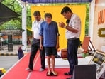 Activist Sonam Wangchuk stands on a weighing machine as he is attended by medical professionals during the protest by Cockroach Janata Party (CJP) demanding Union education minister Dharmendra Pradhan's resignation over alleged irregularities in the NEET examination, at Jantar Mantar in New Delhi on Tuesday, July 14, 2026.