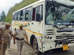 People around the bus that was damaged in pile-up in Ramban on Monday. (ANI Video Grab)