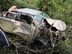 The mangled remains of the car after mishap in Himachal Pradesh’s Sirmaur, on Monday. (HT Photo)