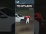 Watch: Dramatic Rescue of Stranded Passenger From Flooded Road In China