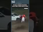 Watch: Dramatic Rescue of Stranded Passenger From Flooded Road In China