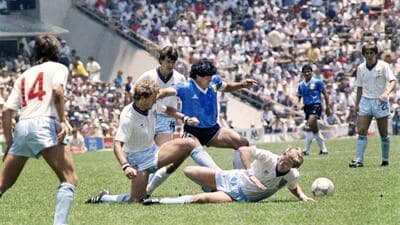 (FILES) Argentine legend Diego Maradona (centre) dribbles past three England defenders on June 22, 1986, in Mexico City during the World Cup quarterfinal. Maradona scored two goals, including the infamous ‘Hand of God’ goal. (AFP) (FILES) Argentine legend Diego Maradona (centre) dribbles past three England defenders on June 22, 1986, in Mexico City during the World Cup quarterfinal. Maradona scored two goals, including the infamous ‘Hand of God’ goal. (AFP)