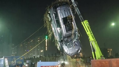 NDRF teams recover the car of the deceased Yuvraj Mehta from a water-filled ditch at a construction site in Sector 150 in Greater Noida, following the accident that occurred on the intervening night of January 16-17, in Greater Noida (ANI file)