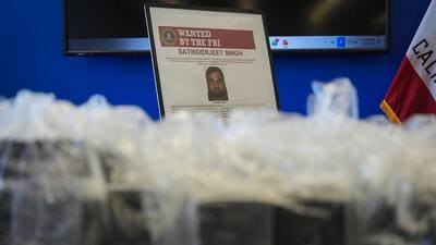 An FBI wanted poster for Satinderjit Singh is displayed at a news conference at the Federal Building in Los Angeles, Tuesday, July 7, 2026. (AP)