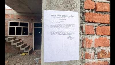 Ayodhya Development Authority (ADA) has pasted a notice on the house linked to Lavkush Mishra, citing alleged violations of building bylaws, in Ayodhya on Tuesday. (ANI Photo) Ayodhya Development Authority (ADA) has pasted a notice on the house linked to Lavkush Mishra, citing alleged violations of building bylaws, in Ayodhya on Tuesday. (ANI Photo)