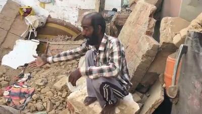 Dharam Singh, the head of the family, sitting amid the rubble of his house after the roof collapsed in Talwandi Sabo on Monday night. (HT Photo)
