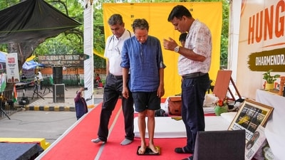 Activist Sonam Wangchuk stands on a weighing machine as he is attended by medical professionals during the protest by Cockroach Janata Party (CJP) demanding Union education minister Dharmendra Pradhan's resignation over alleged irregularities in the NEET examination, at Jantar Mantar in New Delhi on Tuesday, July 14, 2026. (Arun Sharma/PTI Photo) Activist Sonam Wangchuk stands on a weighing machine as he is attended by medical professionals during the protest by Cockroach Janata Party (CJP) demanding Union education minister Dharmendra Pradhan's resignation over alleged irregularities in the NEET examination, at Jantar Mantar in New Delhi on Tuesday, July 14, 2026. (Arun Sharma/PTI Photo)
