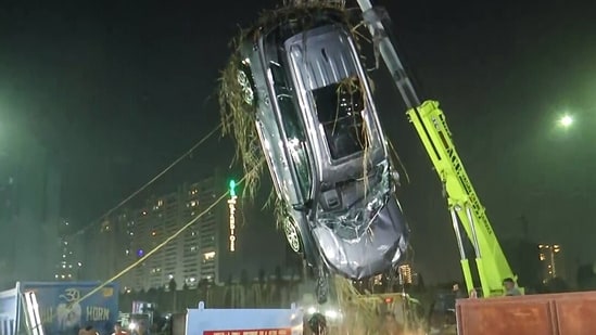 NDRF teams retrieve the car of deceased Yuvraj Mehta from a water-filled pit at the construction site in Sector 150 of Greater Noida, after the accident on the intervening night of January 16-17, in Greater Noida