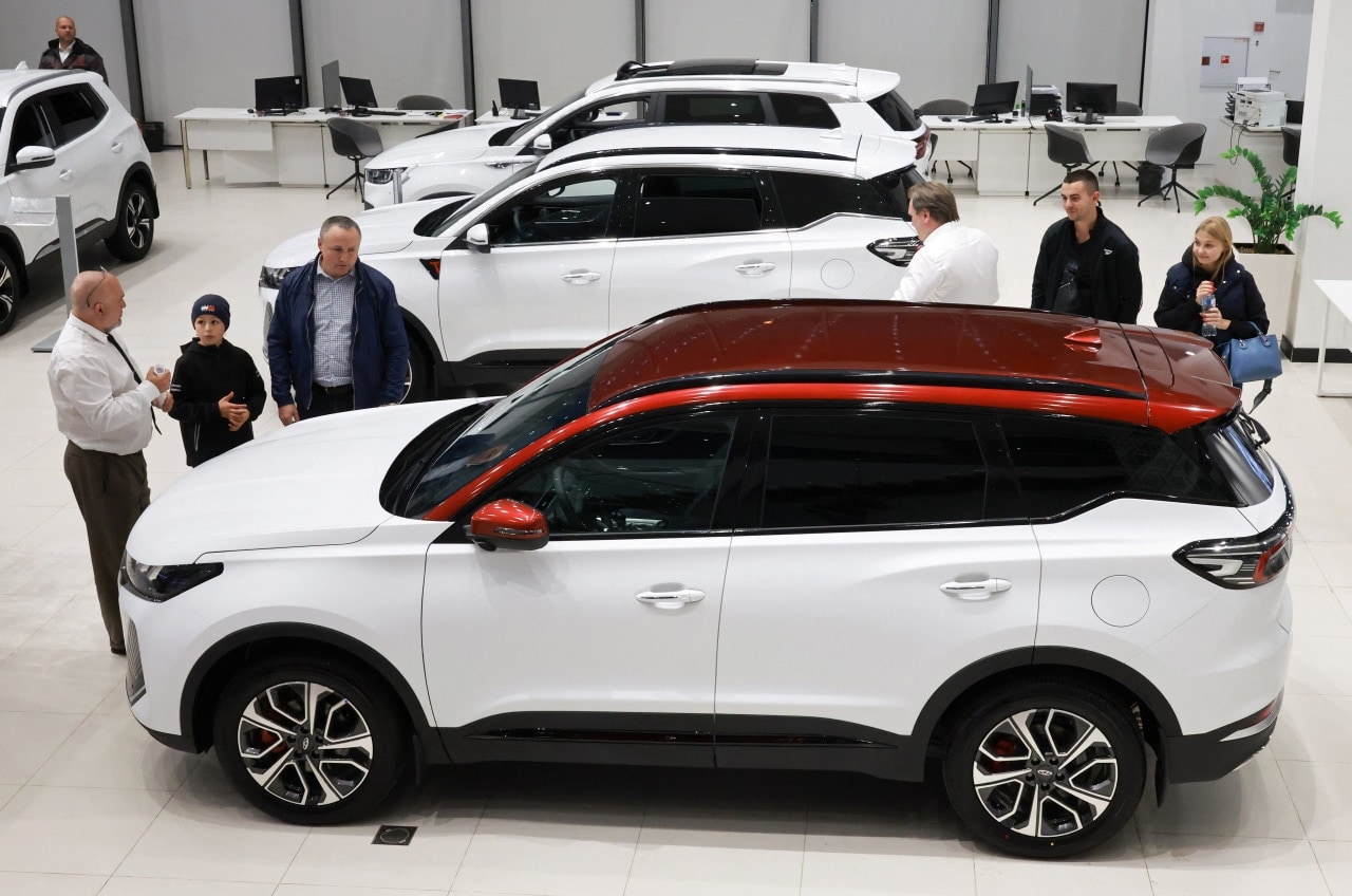 People look at cars produced by Chinese automaker Chery, at a dealership in Saint Petersburg, Russia. People look at cars produced by Chinese automaker Chery, at a dealership in Saint Petersburg, Russia.