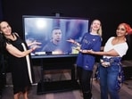 L-R: Kareen Cappai, Kateryna Bila and director of Alliance Française de Delhi, Patricia Loison, cheering for French captain Kylian Mbappé before the match