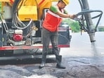Officials said the system uses a single machine to completely clean and fill a pothole. (HT Photo)