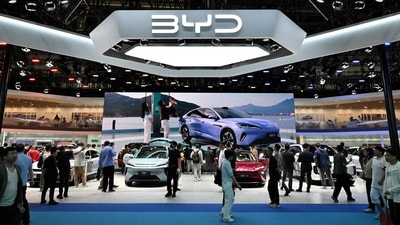 People visit the BYD booth at the Beijing Auto Show. (AFP) People visit the BYD booth at the Beijing Auto Show. (AFP)