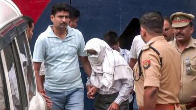 Police take two accused, Ramashankar Mishra and Subhash Chandra Srivastava, from the district jail following the remand by the court in the alleged embezzlement of Ram temple donations, in Ayodhya on Wednesday. (ANI VIDEO GRAB) Police take two accused, Ramashankar Mishra and Subhash Chandra Srivastava, from the district jail following the remand by the court in the alleged embezzlement of Ram temple donations, in Ayodhya on Wednesday. (ANI VIDEO GRAB)