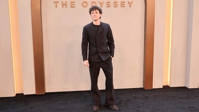 Tom Holland looked dapper at the New York screening of The Odyssey, wearing a chocolate-brown suit with a tailored blazer featuring a signature collar and tapered pants. The suede brown dress shoes completed the look. (Getty Images via AFP) Tom Holland looked dapper at the New York screening of The Odyssey, wearing a chocolate-brown suit with a tailored blazer featuring a signature collar and tapered pants. The suede brown dress shoes completed the look. (Getty Images via AFP)