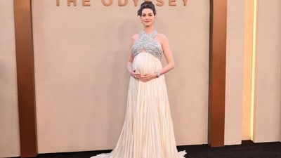 Anne Hathaway mastered maternity fashion as she arrived at the New York premiere of her movie in an impressive custom Prada gown. Styled by Erin Walsh, the Grecian look was a nod to Anne's character in the film, Penelope, the fiercely loyal Queen of Ithaca. (Getty Images via AFP) Anne Hathaway mastered maternity fashion as she arrived at the New York premiere of her movie in an impressive custom Prada gown. Styled by Erin Walsh, the Grecian look was a nod to Anne's character in the film, Penelope, the fiercely loyal Queen of Ithaca. (Getty Images via AFP)