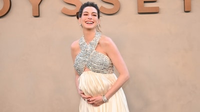 Anne styled the pleated champagne-coloured floor-length ensemble, featuring a dazzling criss-cross crystal bodice with silver cuffs and coordinating silver snakeskin studs with emerald eyes. (AFP) Anne styled the pleated champagne-coloured floor-length ensemble, featuring a dazzling criss-cross crystal bodice with silver cuffs and coordinating silver snakeskin studs with emerald eyes. (AFP)