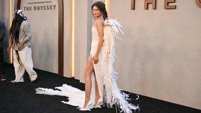 To top it all off, feather-adorned wings on the back take the ethereal, avant-garde look to the next level. Her makeup remained soft and understated, and a long, intentionally undone braid cascading down her back added an earthy fantasy to the dress. (AFP) To top it all off, feather-adorned wings on the back take the ethereal, avant-garde look to the next level. Her makeup remained soft and understated, and a long, intentionally undone braid cascading down her back added an earthy fantasy to the dress. (AFP)