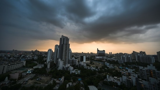 Gram it: A dramatic view of dark monsoon clouds looming over the skyline before rain in Sector 67, Gurugram, on Tuesday night. While IMD has forecast partly cloudy sky for today, brace yourselves for hot and humid conditions simultaneously. The maximum temperatures are likely to range between 37°C to 39°C. (Photo: Parveen Kumar/HT)