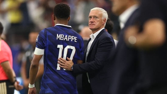 Didier Deschamps, Head Coach of France, reacts with Kylian Mbappe #10 after the 0-2 loss during the FIFA World Cup 2026 Semi Final match between France and Spain
