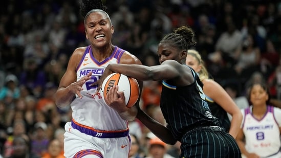 Phoenix Mercury forward Alyssa Thomas, left, tries to go up for a shot against Chicago Sky forward Aicha Coulibaly during the first half of a WNBA basketball game, July 7, 2026, in Phoenix. (AP Photo)