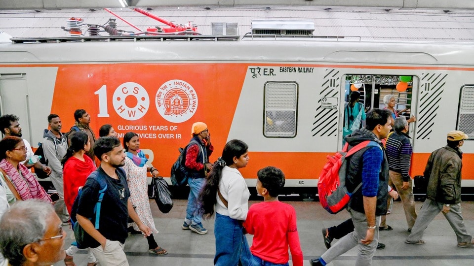 Kolkata: Passengers arrive to board an EMU local train decorated to commemmorate 100 years of electrification by the Indian Railways, at Howrah Station in Kolkata, Tuesday, Feb. 4, 2025. (PTI Photo)(PTI02_04_2025_000392B)