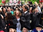 Harvard University graduates celebrate during commencement exercises on the school’s campus on May 28. (AP)