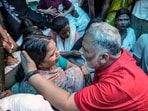 Independent MP Rajesh Ranjan alias Pappu Yadav consoles a breaved family member of Bunty Yadav, who was allegedly abducted by unidentified people on July 6th and whose body was found five days later in the Athmalgola area of Patna district, during a meeting, in Patna on Wednesday. (PTI)
