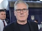 Keir Starmer backed a FIFA investigation after Argentina players displayed a Falklands banner, triggering criticism from UK officials. (Photo by Stefan Rousseau / POOL / AFP)