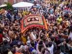Priests and servitors take out a procession as the annual Jagannath Rath Yatra commences, at Jagannath Dham in Puri, Odisha.