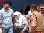 Police take two accused, Ramashankar Mishra and Subhash Chandra Srivastava, from the district jail following the remand by the court in the alleged embezzlement of Ram temple donations, in Ayodhya on Wednesday. (ANI VIDEO GRAB)