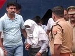 Police take two accused, Ramashankar Mishra and Subhash Chandra Srivastava, from the district jail following the remand by the court in the alleged embezzlement of Ram temple donations, in Ayodhya on Wednesday. (ANI VIDEO GRAB)