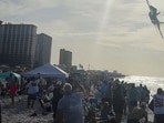 A Navy Blue Angels jet flies low over the crowd on Pensacola Beach, in Florida, U.S., July 15, 2026, in this screengrab obtained from a social media video. (Partridge Drones via Facebook/via REUTERS)