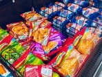 An oncologist evaluates various frozen foods and assigns them health scores based on their nutritional risks.