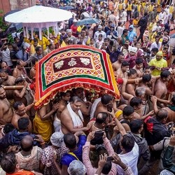 Priests and servitors take out a procession as the annual Jagannath Rath Yatra commences, at Jagannath Dham in Puri, Odisha. 