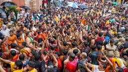 Devotees play traditional Odia gong (Ghanta) during the Mahaprabhu Jagannath Rath Yatra at Puri Jagannath temple, in Puri on Thursday.&nbsp;(@JagannathaDhaam)