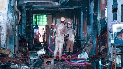Two people died after a fire, suspected to have been caused by a spark from a charged electric car battery in a parking lot, broke out in a five-storey residential building in Mamora Village, Sector 66, in Noida, India, on Wednesday, July 15, 2026. (Photo by Sunil Ghosh/Hindustan Times)