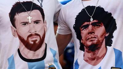 Argentina fans wearing t-shirts depicting Lionel Messi and Diego Maradona. (REUTERS)
