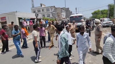 As the workers blocked the JCB, police intervened and used mild force to disperse the protesters before detaining 10 of them. (HT) As the workers blocked the JCB, police intervened and used mild force to disperse the protesters before detaining 10 of them. (HT)