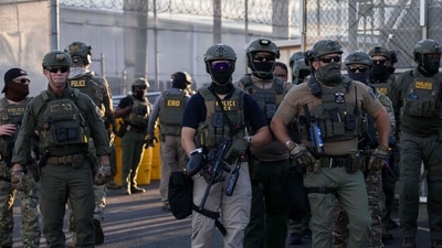 ICE agents stand guard outside the Delaney Hall Immigration Detention Center in Newark, New Jersey. (Getty Images via AFP)