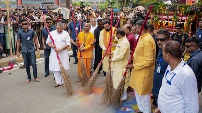 Bihar Chief Minister Samrat Choudhary along with state Deputy CM Vijay Kumar Choudhary and others sweep a road during the annual Jagannath Rath Yatra procession organised by ISKCON, in Patna. (PTI) Bihar Chief Minister Samrat Choudhary along with state Deputy CM Vijay Kumar Choudhary and others sweep a road during the annual Jagannath Rath Yatra procession organised by ISKCON, in Patna. (PTI)