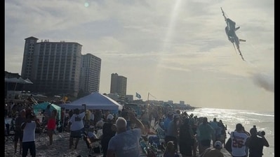 A Navy Blue Angels jet flies low over the crowd on Pensacola Beach, in Florida, U.S., July 15, 2026, in this screengrab obtained from a social media video. (Partridge Drones via Facebook/via REUTERS) A Navy Blue Angels jet flies low over the crowd on Pensacola Beach, in Florida, U.S., July 15, 2026, in this screengrab obtained from a social media video. (Partridge Drones via Facebook/via REUTERS)