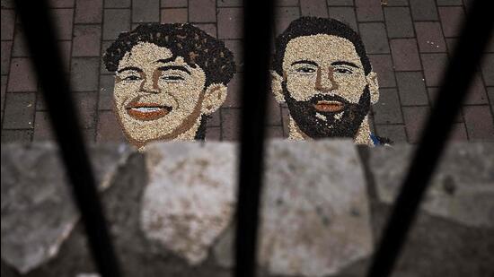 A photograph shows a mosaic made by Kosovar artist Alkent Pozhegu with grain and seeds, depicting Argentina's Lionel Messi (R) and Spain's Lamine Yamal, in the town of Gjakova. (AFP)