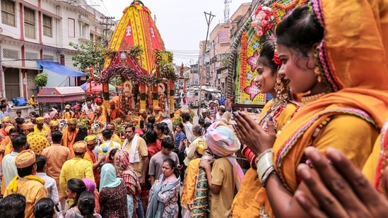 Devotees pull the chariot carrying the idols of Lord Jagannath, Lord Balabhadra and Goddess Subhadra during the annual Jagannath Rath Yatra procession, in Prayagraj, Thursday, July 16, 2026. (PTI Photo)