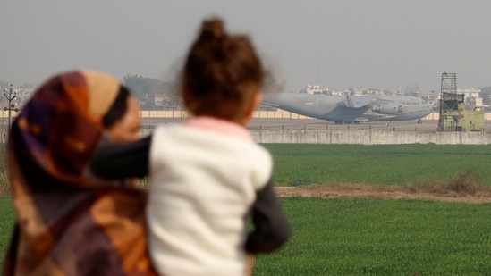 People look at a US military plane deporting Indian immigrants as it lands in Amritsar. (REUTERS/File photo)
