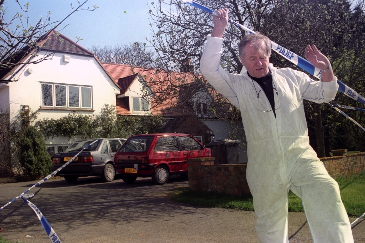 A police forensic expert walking fromJanet Brown’s house, where she was killed. A police forensic expert walking fromJanet Brown’s house, where she was killed.
