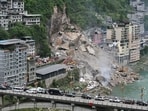 Rescue workers search for survivors at the site of a landslide along Wujiang river in Pengshui Miao and Tujia Autonomous County, Chongqing, China July 17, 2026. 