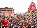 Devotees carry Lord Jagannath to the chariot as they participate in the Mahaprabhu Jagannath Rath Yatra in Puri. (X)