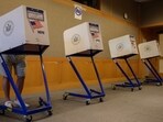 (FILES) A voter stands in a booth at a voting station at the Metropolitan Museum of Art (MET) during the mayoral election process in New York on June 12, 2021.